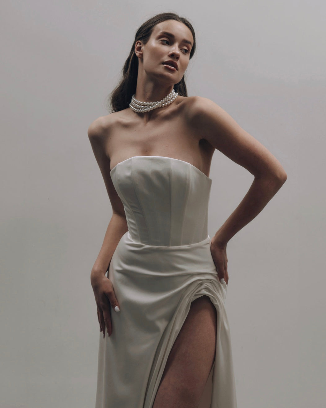 SCULPTURAL CORSET DRESS WITH CAPE