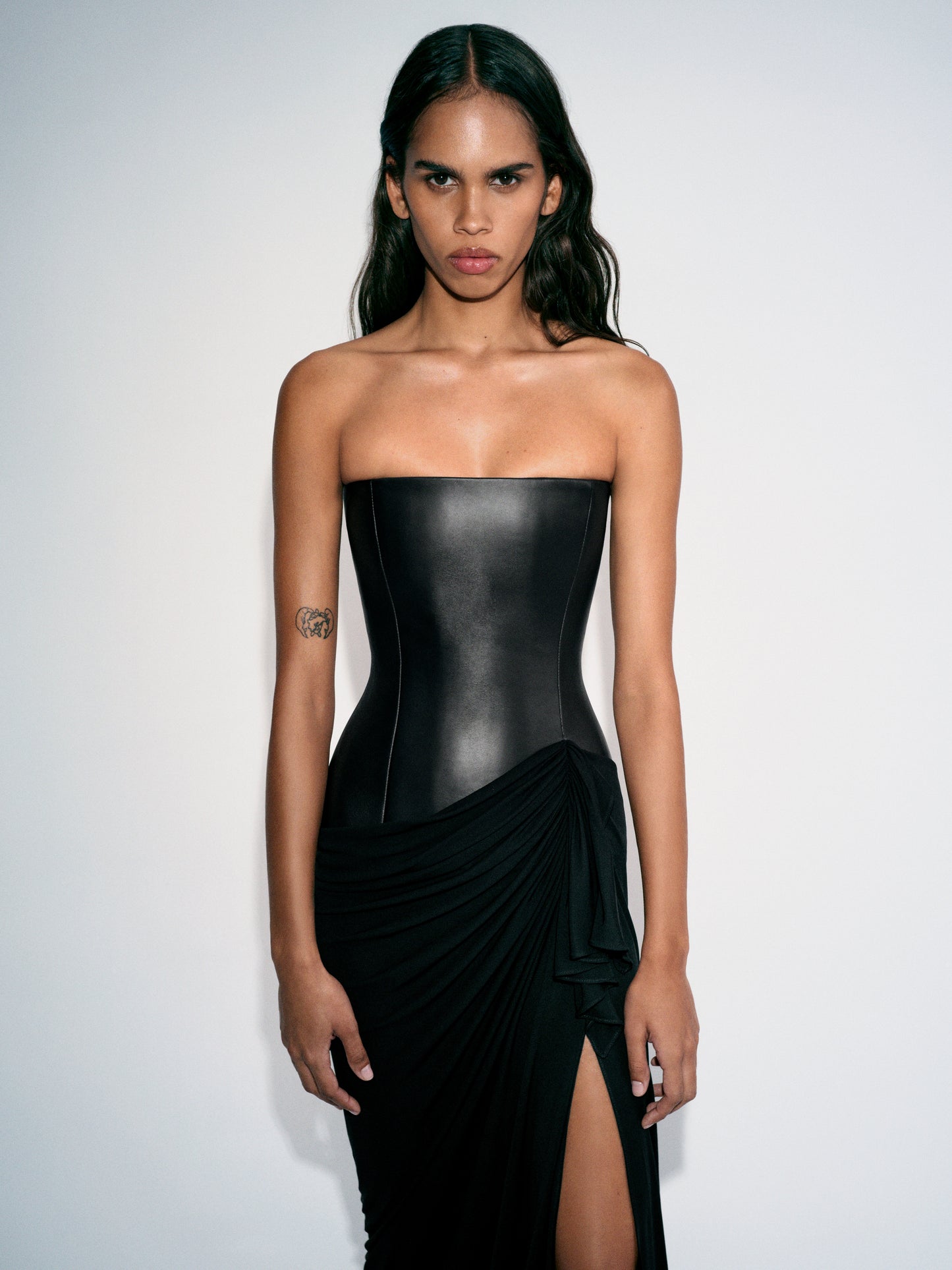 STRAPLESS LONGLINE ASYMMETRIC GOWN IN LEATHER & DRY JERSEY
