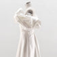 CORSET DRESS WITH MERINGUE FLOUNCES